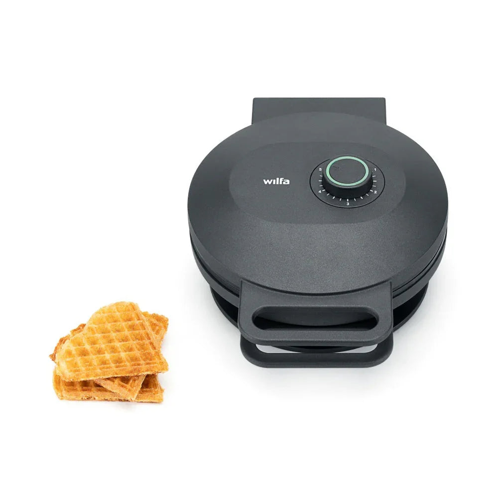 Single waffle maker with round lid, temperature dial, and lower handle stand