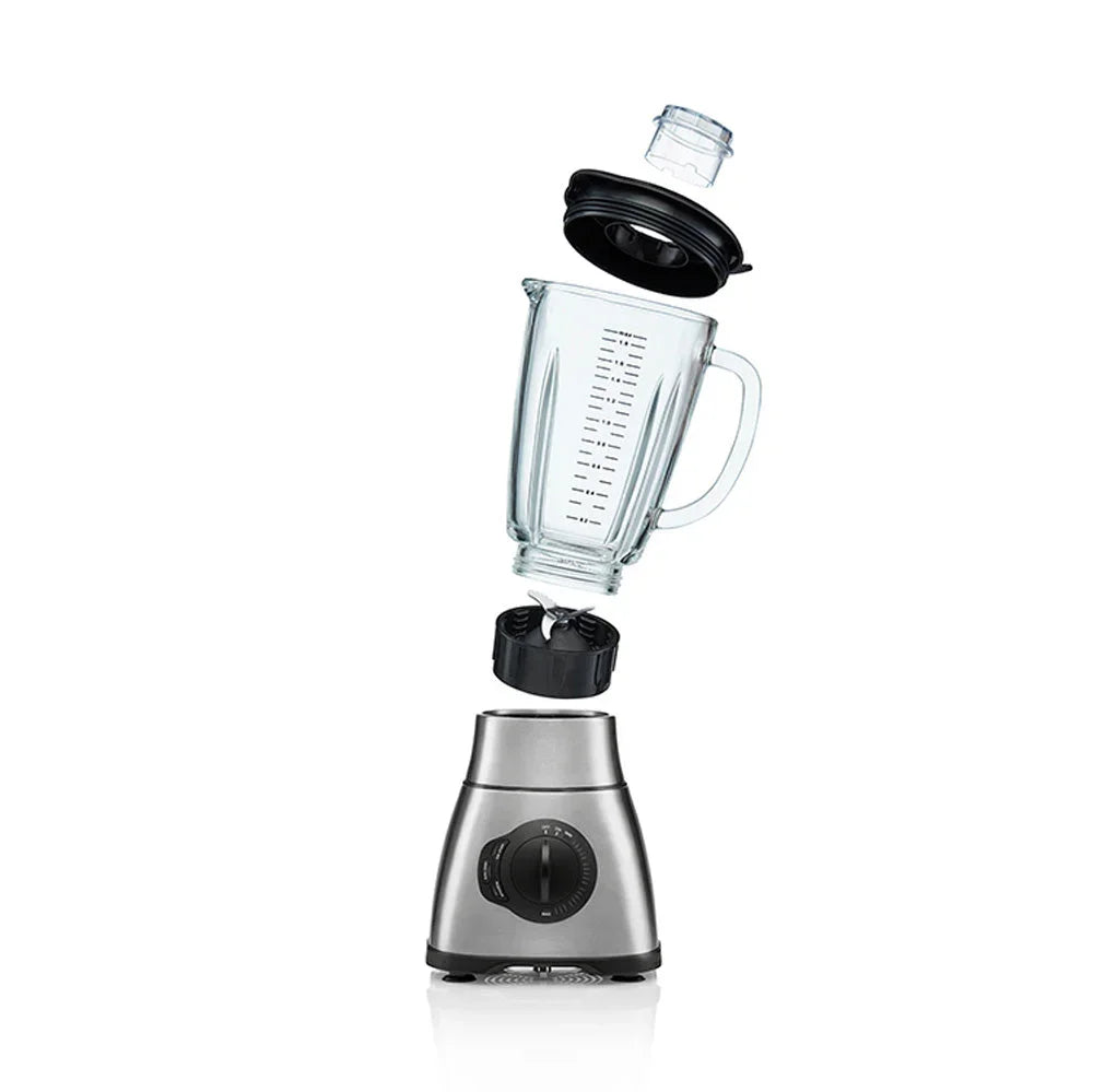 Stand mixer with empty glass jug, lid and stainless base with speed dial